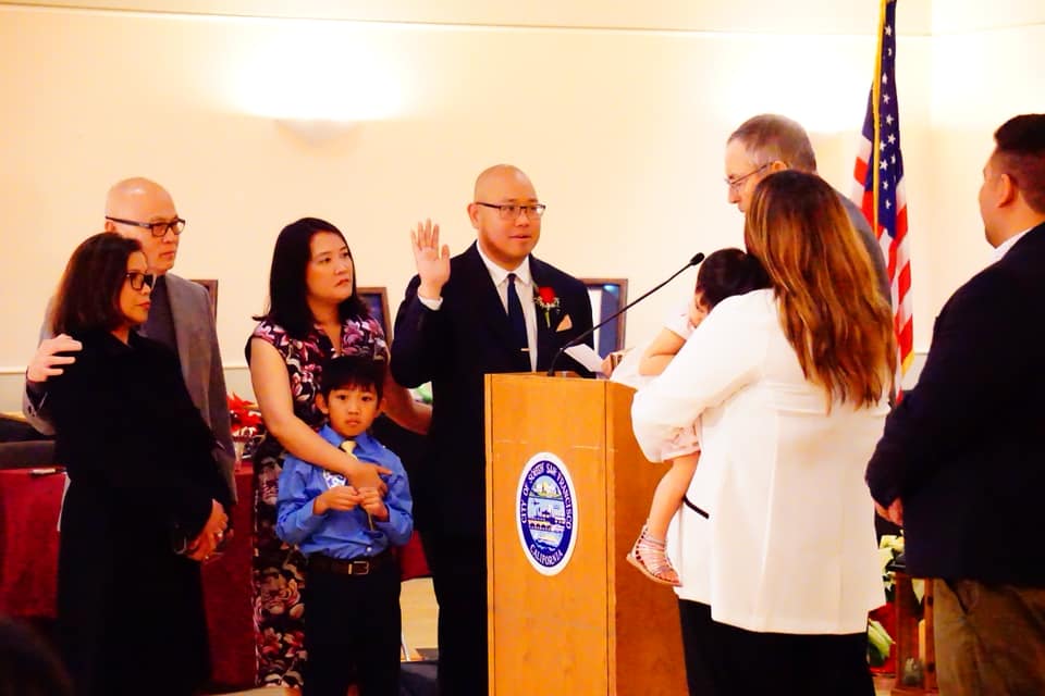 Mark Nagales being sworn in with Gene Mullin